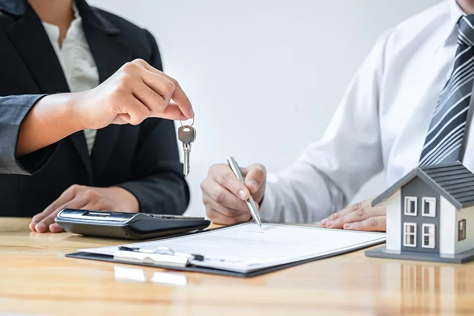 Refinancing Mackay: signing loan documents at settlement